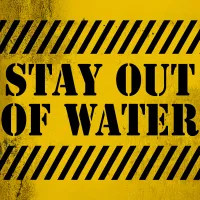 Stay out of water sign because of beach dangers in 2025