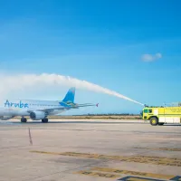 Plane at Queen Beatrix International Airport being welcomed in 2025