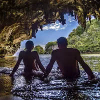 Couple sit in a hidden cave in the Dominican Republic in 2025