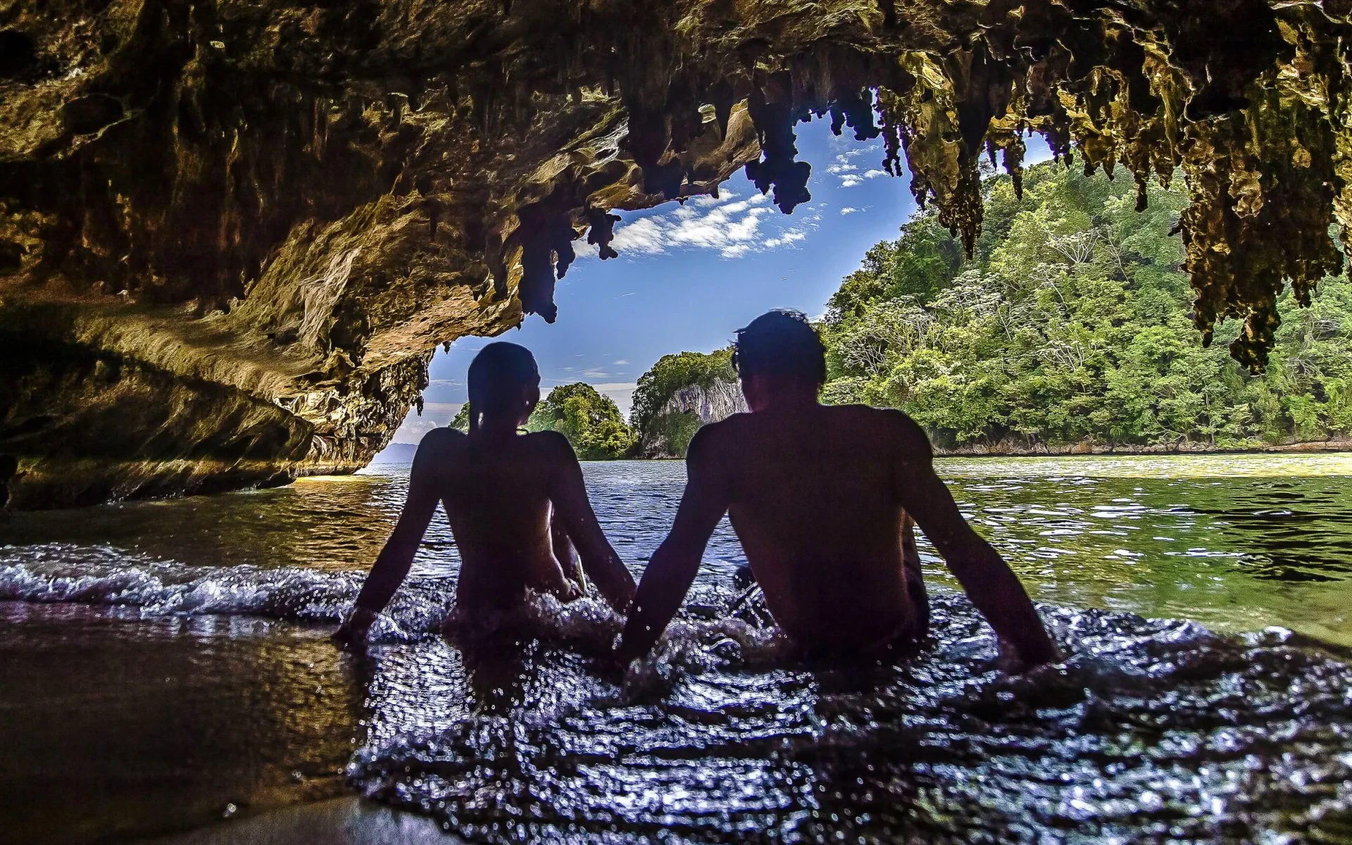 Couple sit in a hidden cave in the Dominican Republic in 2025